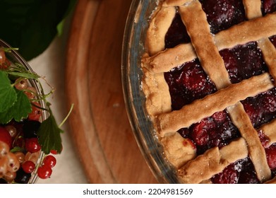 Cropped View Classic American Festive Cherry Pie With Crispy Sweet Pastry Lattice And Fresh Ripe Organic Berries In Bowl. Homemade Berry Cake With Flaky Crust. Thanksgiving Concept. Bakery Products