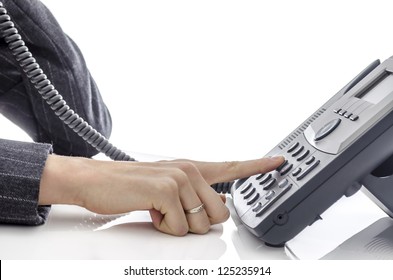 Cropped View Of Female Hand Dialing A Phone Number.