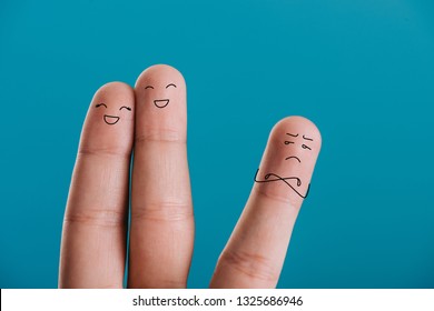 Cropped View Of Fingers As Happy Couple And Third Wheel Isolated On Blue