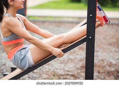 Cropped View Of Fit Woman Exercising On Sit Up Bench In Outdoor Gym