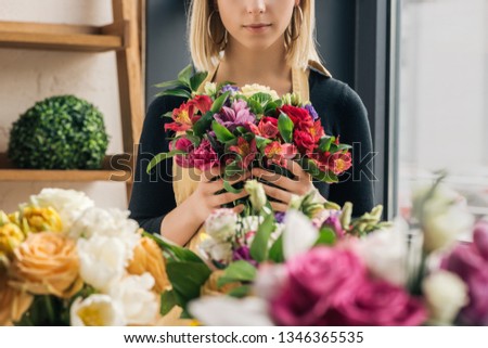 Similar – Foto Bild Floristin bindet einen bunten Strauß Blumen