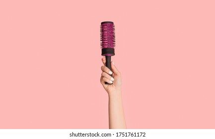 Cropped View Of Girl Holding Hair Brush On Pink Background, Close Up. Panorama