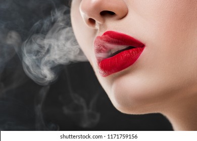 Cropped View Of Girl With Red Lips Blowing Smoke, Isolated On Grey