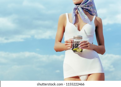 Cropped View Of Girl In White Vintage Swimsuit Holding Mason Jar With Fresh Lemonade