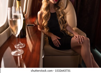 Cropped View Of Glamorous Woman With Champagne Sitting In Plane