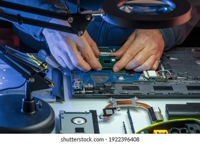 Cropped View Of Hands Of IT Specialist Replacing Details In Computer Repair Workshop, Hardware Upgrading. A Real Case Of Service Assistance.