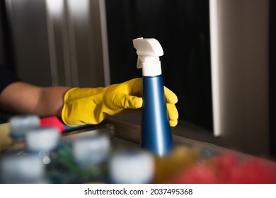 Cropped View Of Maid In Rubber Glove Reaching Spray Bottle