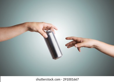 Cropped view of a male hand giving a beer can to another person