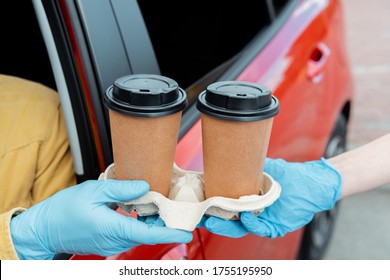 Cropped View Of Man In Protective Gloves Buying Coffee To Go From Car During Covid-19 Pandemic 
