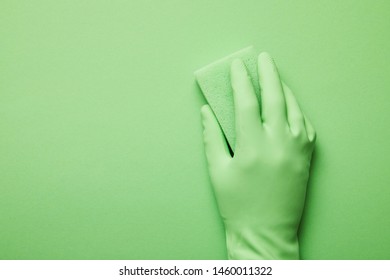 Cropped View Of Man In Rubber Glove Holding Green Sponge 