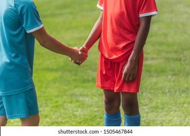 cropped view of multicultural kids shaking hands 