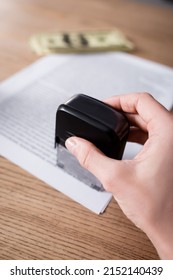 Cropped View Of Notary With Stamper Near Blurred Contract And Money