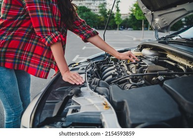 Cropped View Portrait Of Attractive Girl Taxi Service Driver Checking Tech Part Of Car Examine On Parking Outdoors