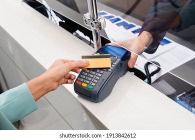 Cropped View Of Receptionist Holding Payment Terminal Near Woman With Credit Card In Hotel