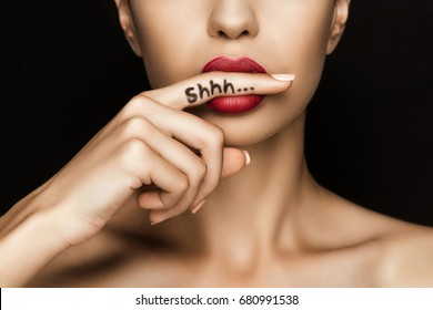 Cropped View Of Seductive Woman With Red Lips Showing Shh Symbol, Isolated On Black  