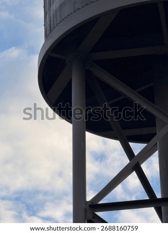 cropped in view of support and inside of elevated vintage watertank 