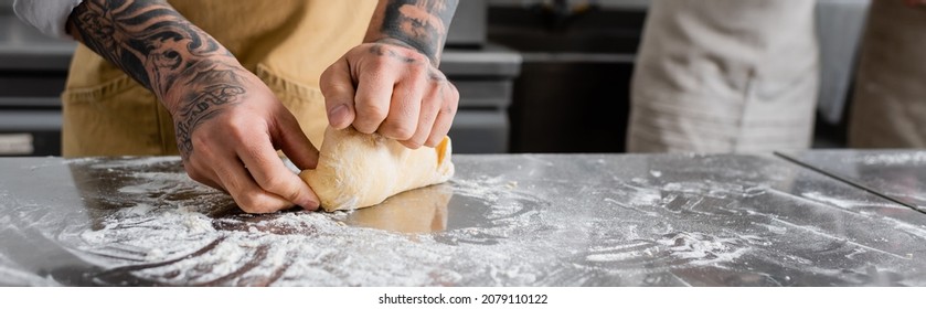 Cropped View Of Tattooed Chef Making Dough Near Flour On Kitchen Table, Banner