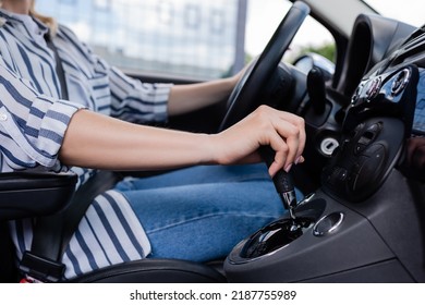 Cropped View Of Woman Driving Car During Course