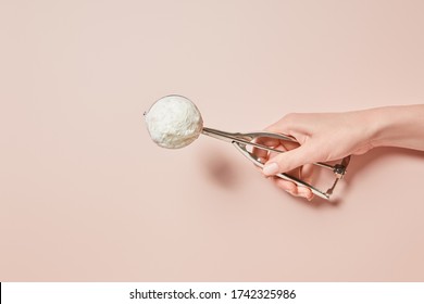 Cropped View Of Woman Holding Fresh Tasty Ice Cream Ball In Scoop On Pink Background