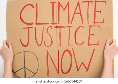 Cropped View Of Woman Holding Placard With Climate Justice Now Lettering On White Background, Global Warming Concept