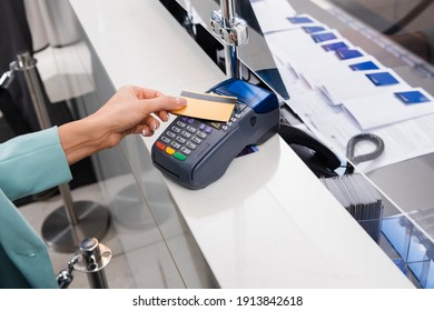 Cropped View Of Woman Paying With Credit Card And Payment Terminal In Hotel