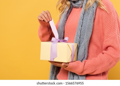 Cropped View Of Woman Untie Ribbon On Gift Box Isolated On Yellow