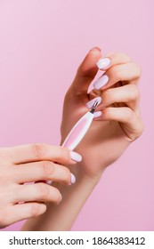 Cropped View Of Woman Using Cuticle Clipper Isolated On Pink