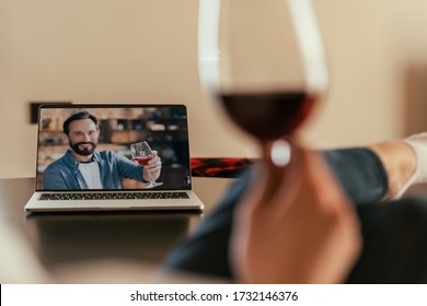 Cropped View Of Woman And Young Man On Screen Of Laptop Toasting With Glasses Of Red Wine