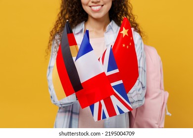 Cropped Young Excited Cheerful Black Teen Girl Student She Wear Casual Clothes Backpack Bag Hold Many Different Flags Isolated On Plain Yellow Color Background. High School University College Concept