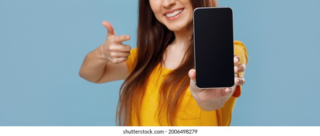 Cropped Of Young Woman Showing Brand New Smartphone With Empty Screen And Thumb Up, Mockup, Blue Studio Background, Mockup, Panorama With Copy Space, Web Banner For Website, Advertisement