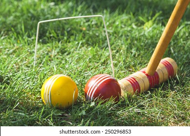 Croquet Mallet and Hoop with Red and Yellow Balls