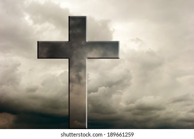 Cross against dramatic cloudy sky - Shutterstock ID 189661259