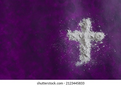Cross of ashes on a dark purple background with copy space - Powered by Shutterstock