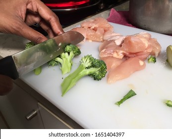 Cross contamination of food, raw and fresh vegetables are on the same chopping board - Shutterstock ID 1651404397