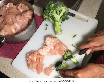 Cross contamination of food, raw and fresh vegetables are on the same chopping board - Shutterstock ID 1651404430