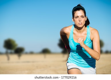 Cross Country Running Sweaty Woman. Female Runner On Countryside Training.