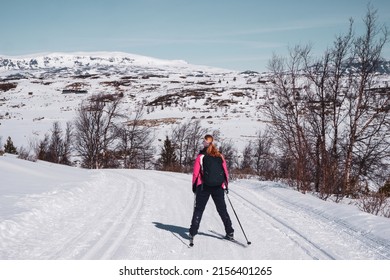 Cross country ski tracks into the winter landscape in Norwegian mountains where people ski during easter break. 