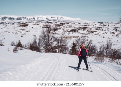Cross country ski tracks into the winter landscape in Norwegian mountains where people ski during easter break. 