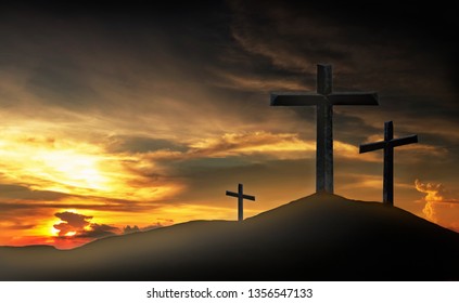 Cross, crucifixion, Jesus Christ on the mountain With a sunset background