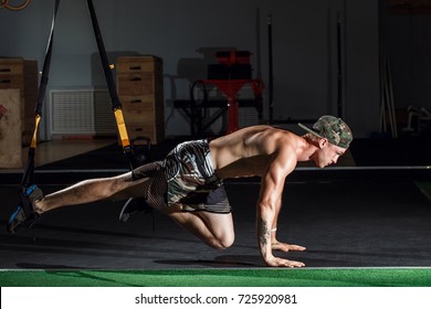 Cross Fit Fitness TRX Training Exercises At Gym Man Side Push-up Workout