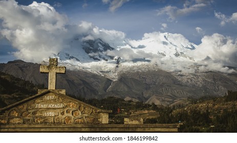 Cross In Front Of The Huascarán Mountain In Yungay