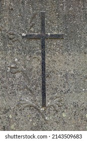 Cross On Grave Stone With Decorations.