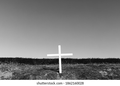 A Cross On A Hillside, A Grave Site In Open Country