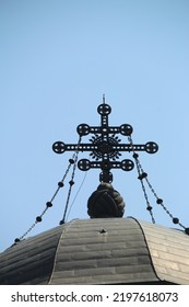 A Cross On The Spire Of A Church