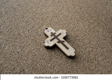 Cross on table . 