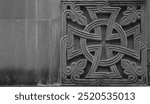 Cross pattee in round, circle , square carved in orthodox christianity church stone wall background. Georgian church. Batumi, Georgia.