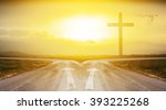 cross with road and sunlight background with shadow edge