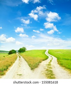 Cross Roads Horizon With Grass And Blue Sky 