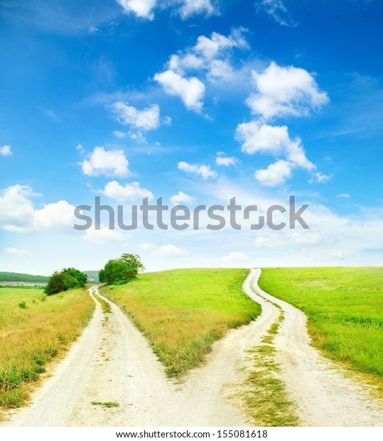 Cross roads\
horizon with grass and blue sky\
