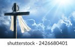 Cross With Robe And Crown Of Thorns Against Sky - Calvary And Resurrection Concept - Sunlight Effect